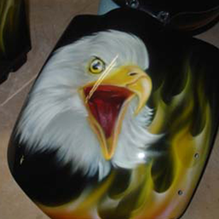 Custom motorcycle paint job with airbrushed eagles and kandy paint