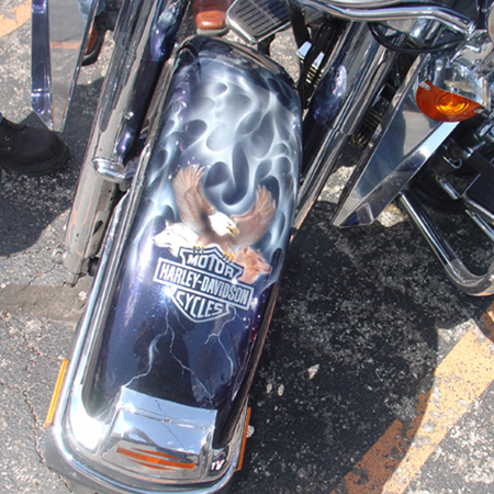 Custom painted harley bagger, ice pear with animal and people portraits, harley logo and flames