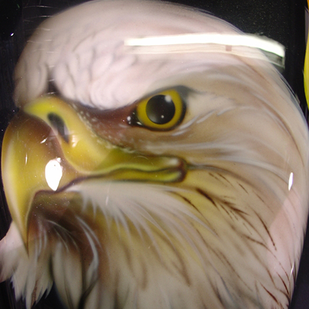 Custom motorcycle paint job with airbrushed eagles 