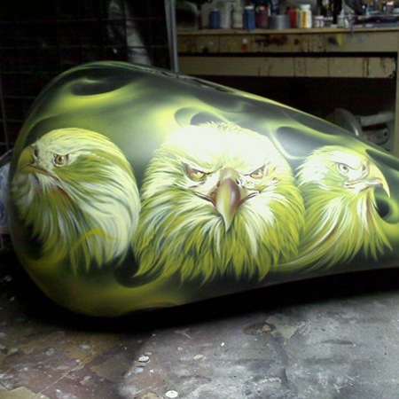 custom painted motorcycle gas tank with eagles and fire