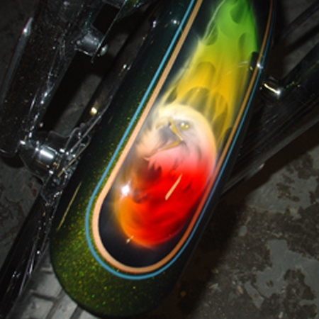 Custom motorcycle paint job with airbrushed eagles and kandy paint