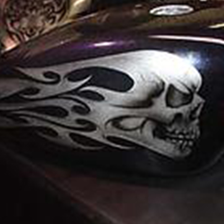 custom painted motorcycle with ice pearl, tribal graphics and skulls