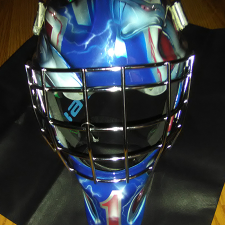 goalie mask with airbrushed sankes and statue of liberty
